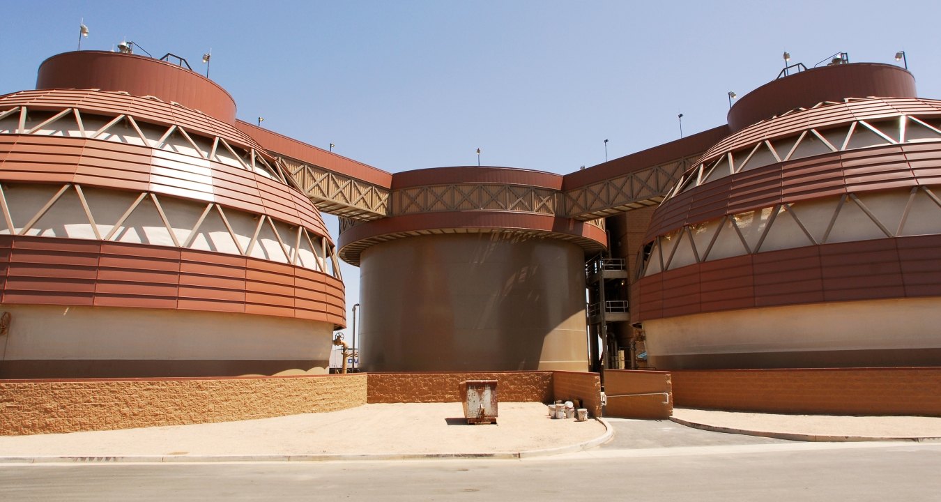 The futuristic brown and beige tanks at the Greenfield Water Reclamation Facility. 
