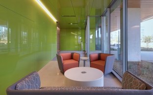 Seating area along window walls inside the UCSD Center for Novel Therapeutics building