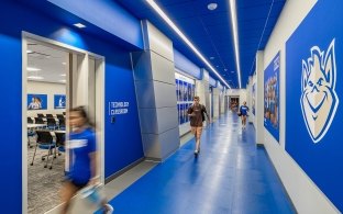 A hallway with blue floors, walls, and ceiling to match SLU's school colors. 