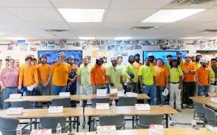 Construction workers in a classroom