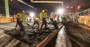Group of people working on a concrete pour 