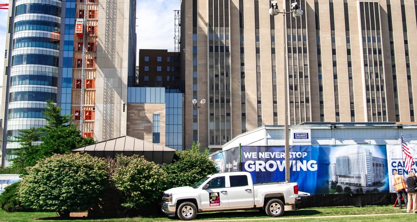 mccarthy truck on lawn by a building.