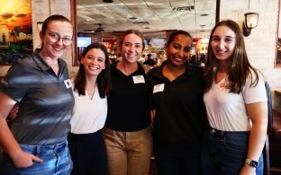 Group of five interns at the intern kickoff event